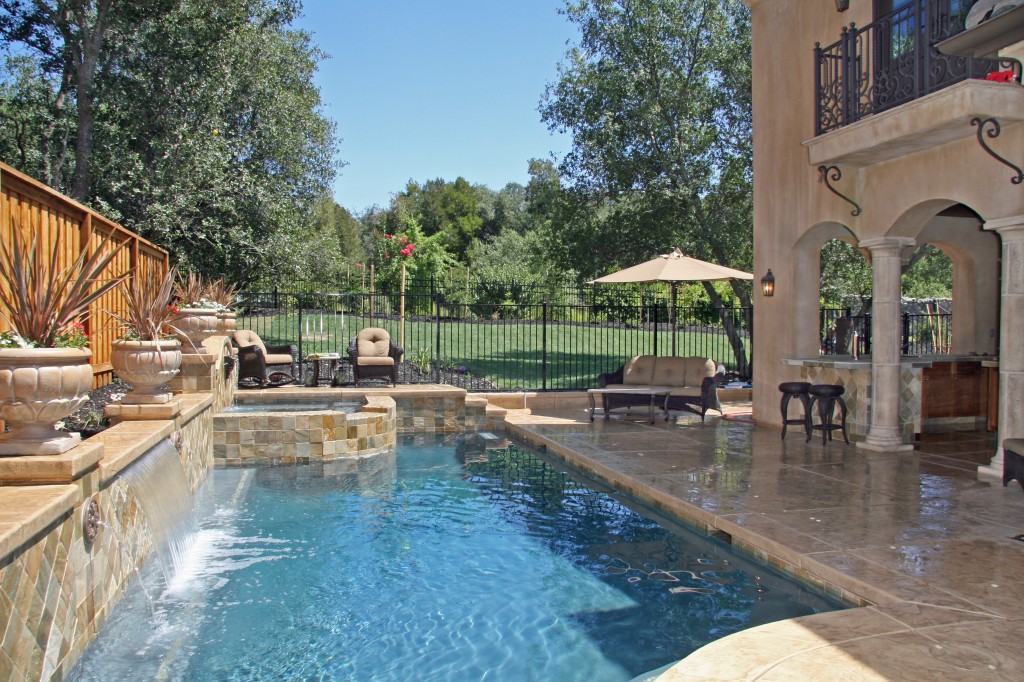 Granite Bay Classic Granite Bay pool construction featuring a pool, spa, and 5' Falls with Quartzite Stone Tile