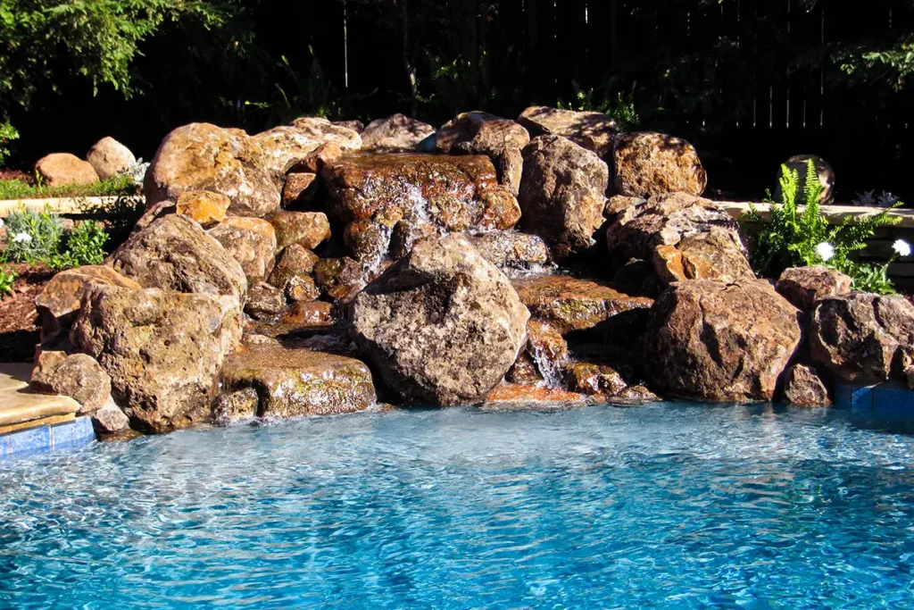 Custom gunite pool with natural stone waterfall feature