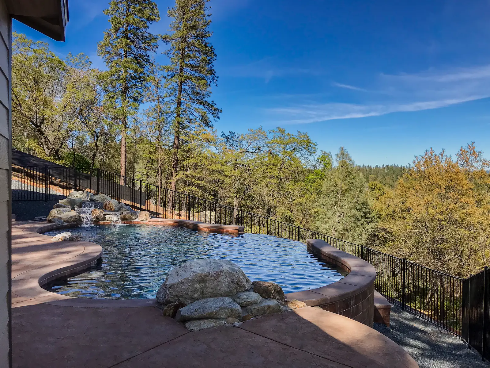 Custom infinity edge pool overlooking the Sierra foothills in Colfax California