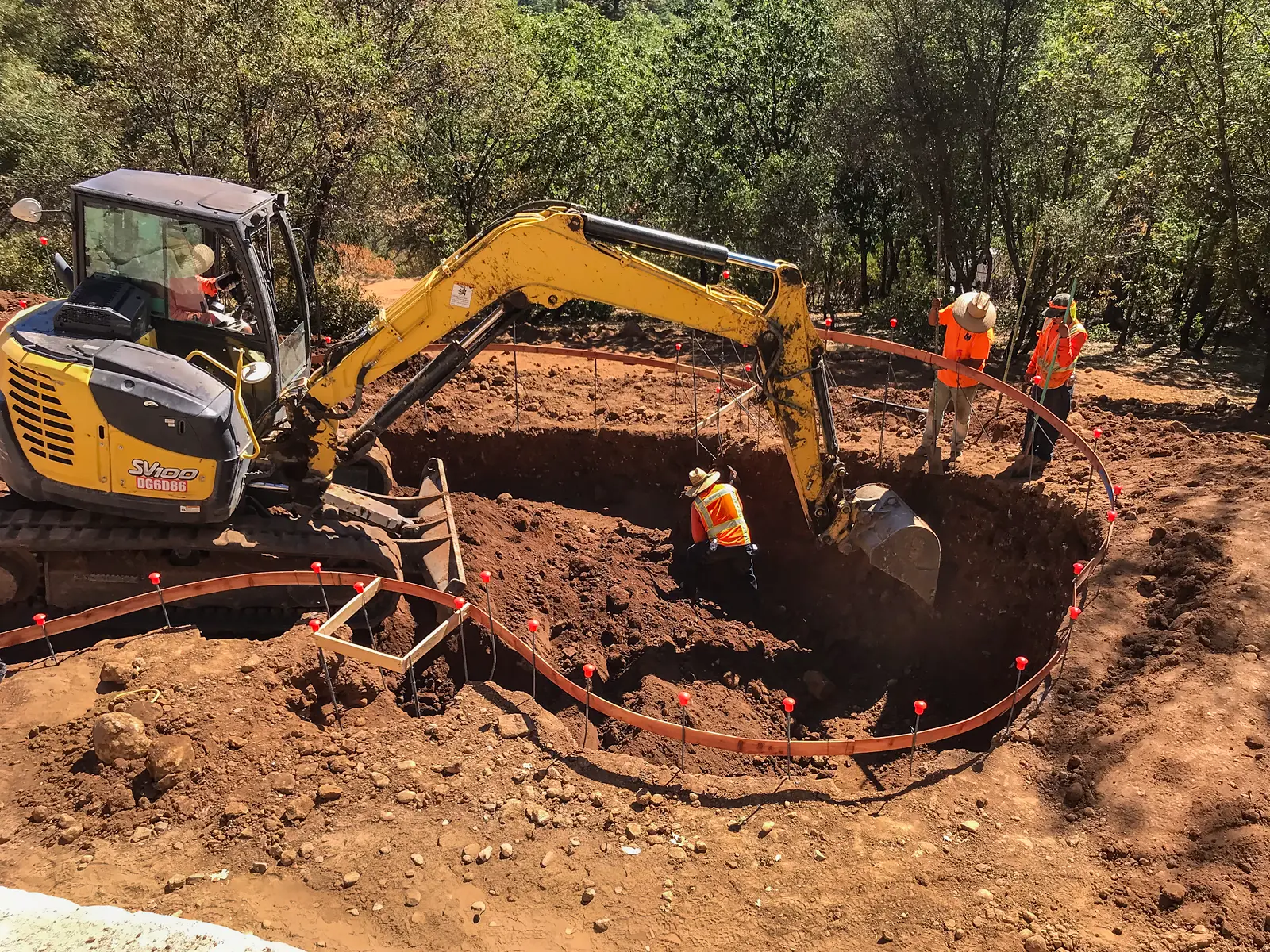 Engineered excavation for a vanishing edge pool on a steep residential hillside in Colfax, California