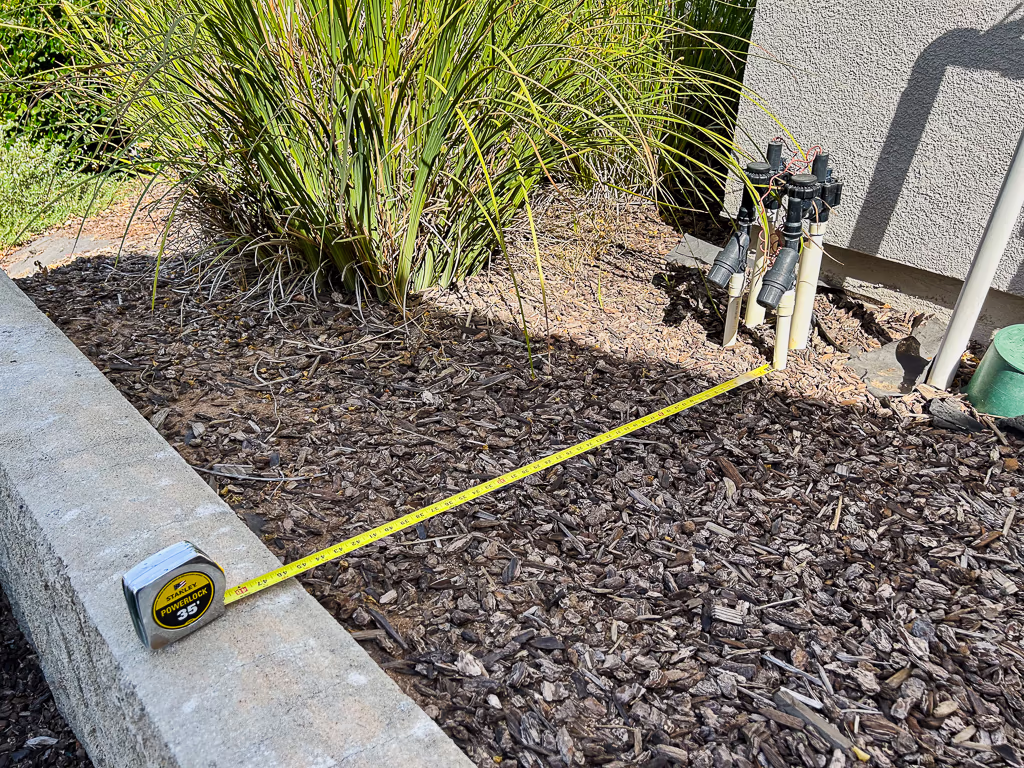 Tape measure showing 3 feet 9.5 inches working clearance during tight access pool site measurement in Rocklin CA