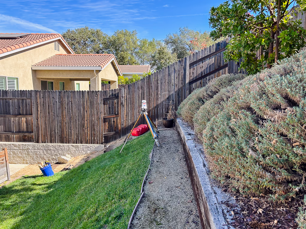 Laser level setup during pool site measurement in Rocklin
