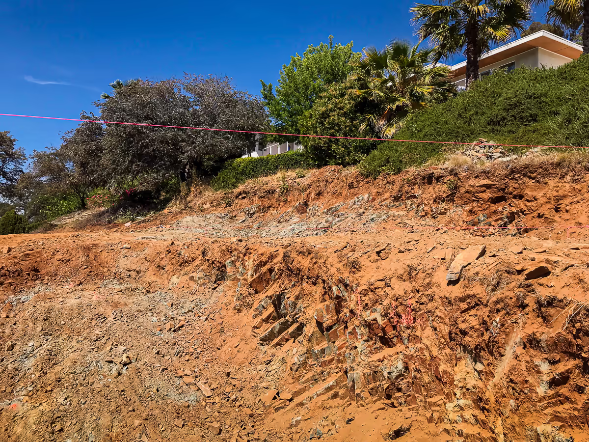 Fractured bedrock exposed in the cut face during Auburn hillside pool excavation — Jim Chandler Pools