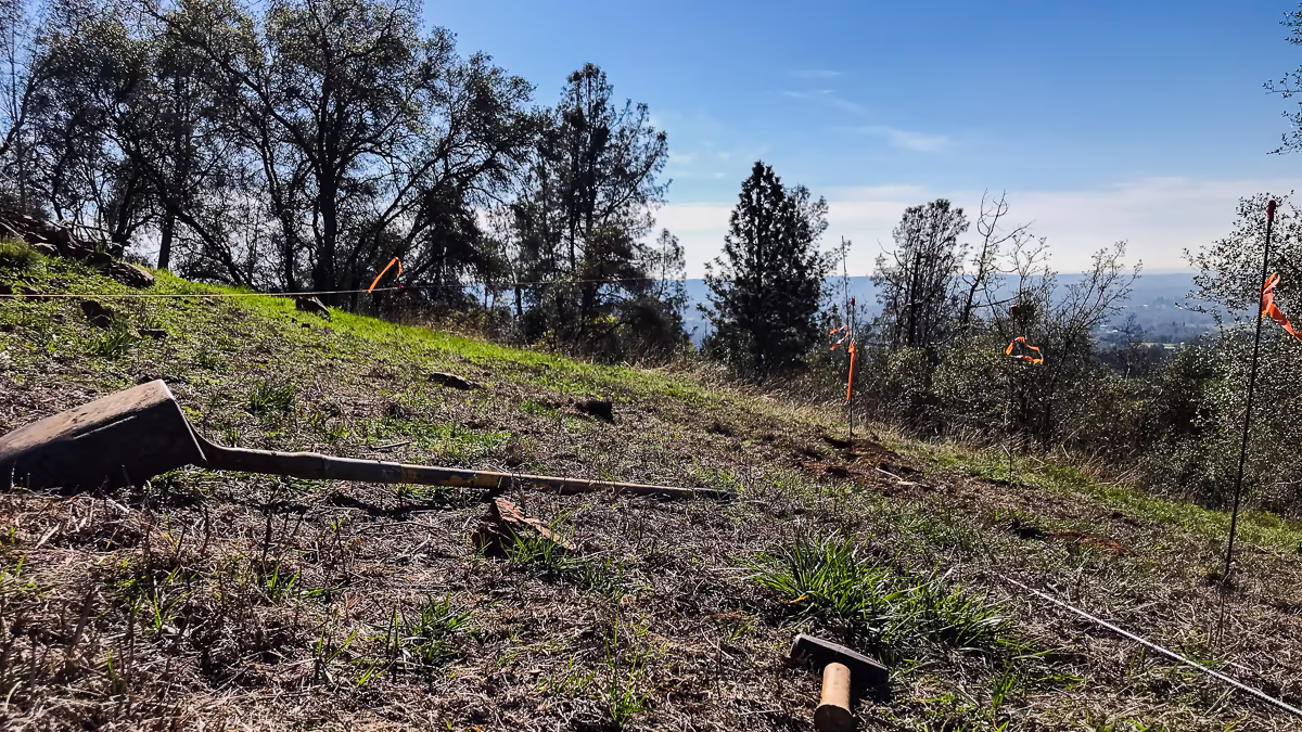 String line established at vanishing edge elevation on the Auburn hillside during layout — over seven feet above natural grade — Jim Chandler Pools