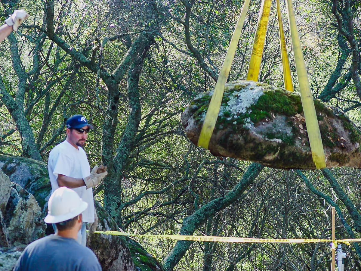 130-million-year-old granite boulder crane-set into position during river pool construction in Placer County by Jim Chandler Pools