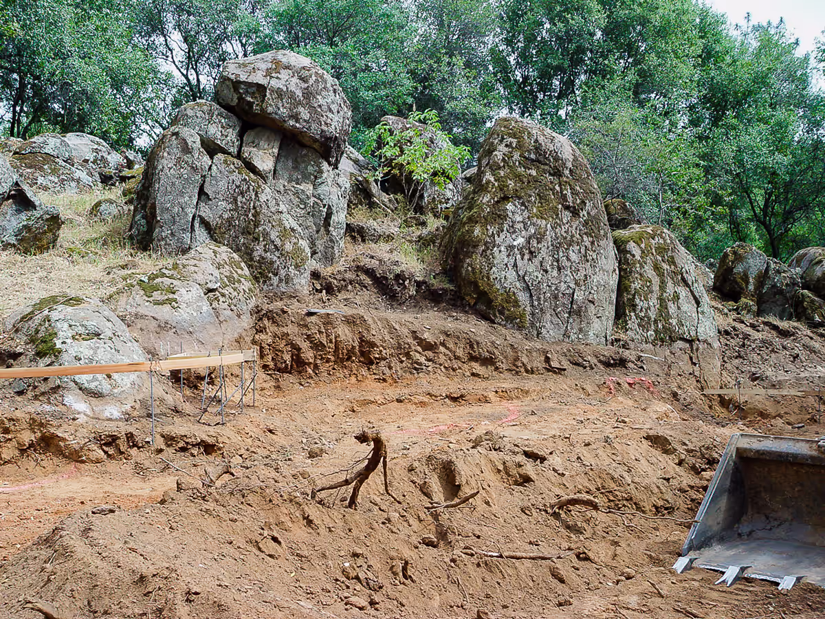 Pool excavation showing 130-million-year-old granite boulders before river pool construction in Placer County by Jim Chandler Pools